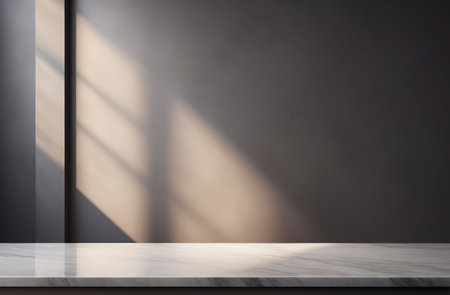 Empty blank marble tabletop on a gray wall with beautiful floral tropical shadow. Minimalistic backdrop for product presentation, podium, pedestal. Showcase, display case. Minimal abstract background.の写真素材