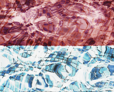 Texture of Monaco flag in the pool, water. Splashes.