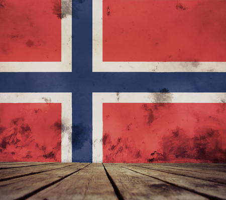 The floor of planks and plastered wall with a Norwegian flag.の写真素材