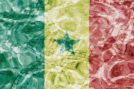 Texture of Senegal flag in the pool, water. Splashes.の写真素材