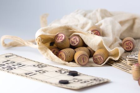 Cards and kegs for Russian lotto (bingo game) Old lotto barrels in a canvas bagの写真素材