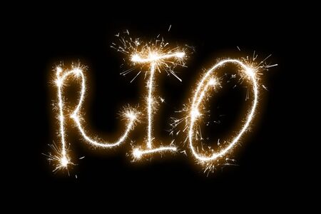 The inscription Rio on a black background with sparklers