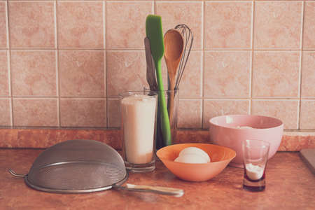 Items and products for making a cake on the table.