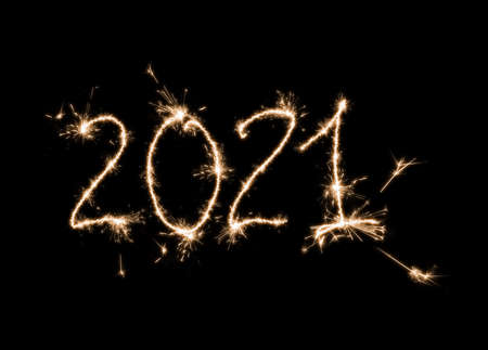 Isolated on black Christmas balls made of sparklers and the inscription 2021.の写真素材