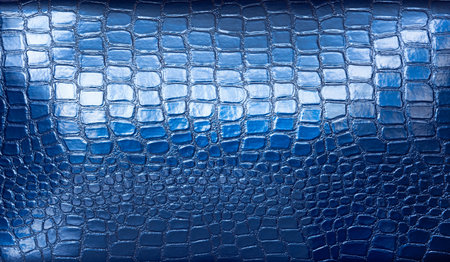 The texture of artificial crocodile skin in blueの写真素材
