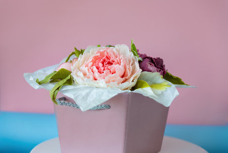 Edible flowers made from chocolate. An original dessert in a box Edible flowers made from chocolate. An original dessert in a box on a pink background.の写真素材