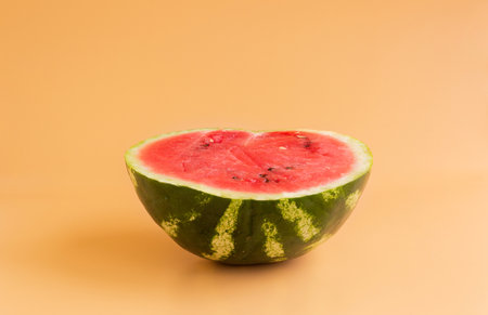 Sliced watermelon on an orange background.の写真素材