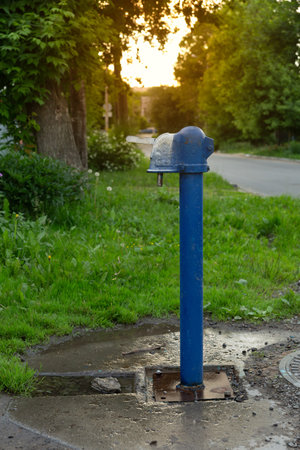 A blue street water pump in the old part of the city.の写真素材