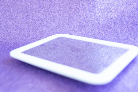 A white frame on a purple shiny background.の写真素材
