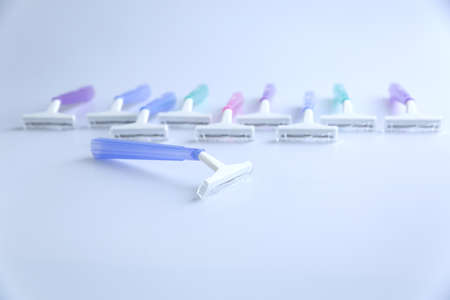 Set of multi-colored disposable razors on white backgroundの写真素材