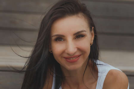 Close-up black white portrait of smiling brunette woman.の写真素材