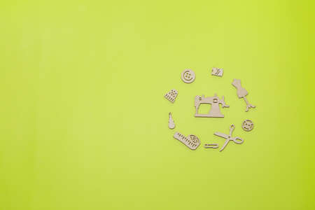 A circle of items for needlework and sewing on a light green background.の写真素材