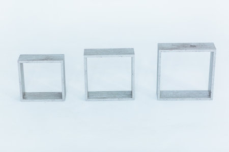 Three three-dimensional square frames on a white backgroundの写真素材