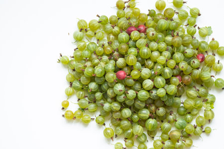 Background of green gooseberries on a white background.の写真素材
