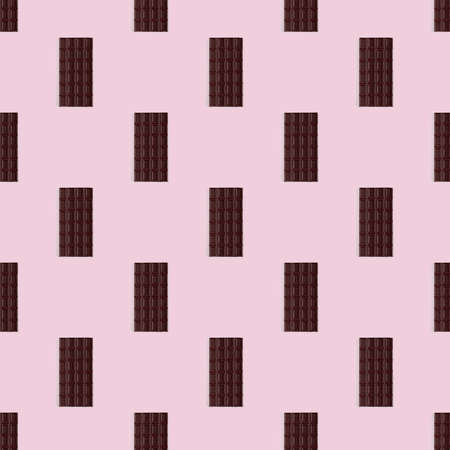 Seamless pattern of chocolate bar on the pink background, texture of chocolate bar.の写真素材