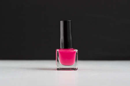 Pink nail polish bottle on balck and white backgroundの写真素材