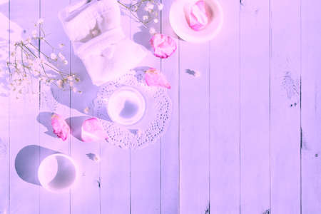 Beautiful spa composition with spring flowers on a light wooden backgroundの写真素材