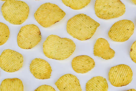texture of potato chips on a light background view from the top. concept of harmful nutritionの写真素材