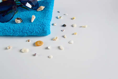 Beautiful composition of a towel with stones, shells and spa on a light background. Holiday towels May 25 close-upの写真素材
