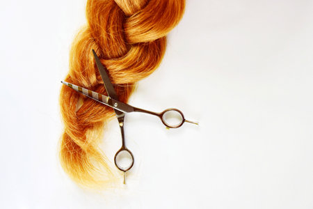 Long braided braid. hairdressing scissors. Beauty Industry Conceptの写真素材
