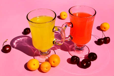 Summer drinks and fruits, cherry and apricot lemonade close up, selective focus, peaches, apricots...