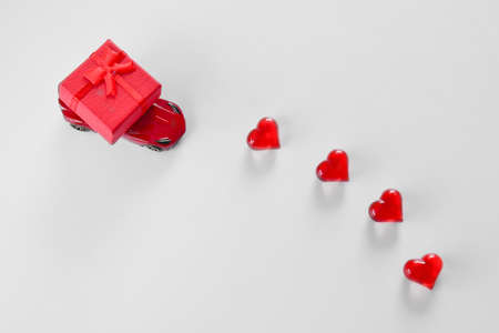 Red box on a small toy car. concept of love for mom and Valentines Day