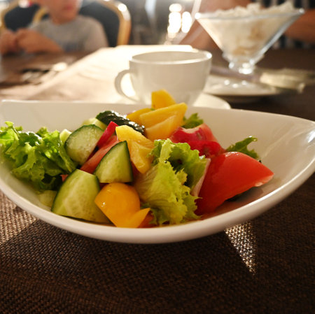 Fresh spring salad with tomatoes, cucumbers greens. Close-up. Macro. Healthy eatingの写真素材