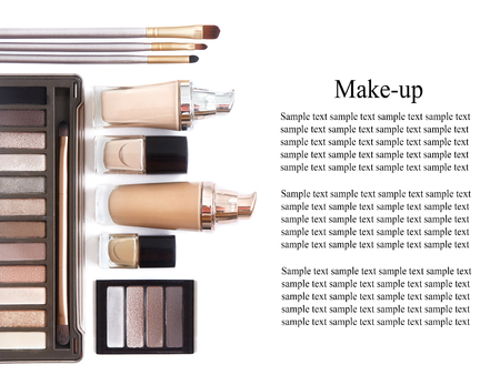 Cosmetics in natural colors and brushes isolated on white background. Makeup tools and accessories. Brow eyeshadows, naturel skin foundation for clean ton on face, nail polish, make-up brushesの写真素材