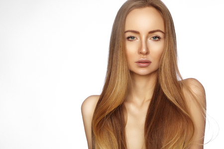 Beautiful yong woman with long straight shiny hair. Sexy fashion model with smooth gloss hairstyle, keratin treatment. Perfect clean skinの写真素材