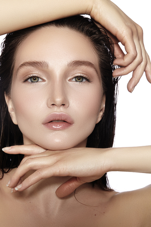 Beautiful Face of young Woman. Skincare, Wellness, Spa. Clean soft Skin, healthy Fresh look. Natural daily makeup, wet hair styleの写真素材