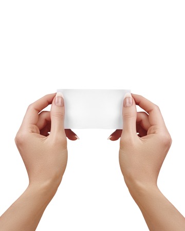 Beautiful female Hand holding paper business card on white background. Gift card, cutaway, graphic design.の写真素材