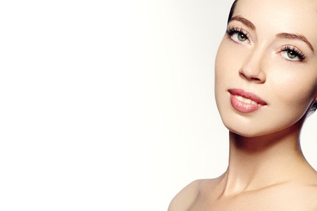 Beautiful face of young woman. Skincare, wellness, spa. Clean soft skin, healthy fresh look. Natural daily makeup.の写真素材