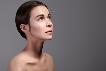 Beauty Woman Face Portrait. Beautiful Spa Model Girl with Perfect Fresh Clean Skin. Youth and Skin Care Concept.の写真素材