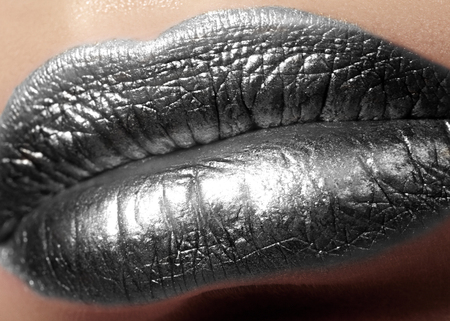 Closeup Female Plump Lips with Silver Color Makeup. Fashion Celebrate Make-up, Glitter Cosmetic. Christmas Metalic Style. New Year Celebrate Lip Makeupの写真素材