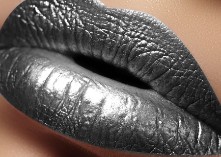 Closeup Female Plump Lips with Silver Color Makeup. Fashion Celebrate Make-up, Glitter Cosmetic. Christmas Metalic Style. New Year Celebrate Lip Makeupの写真素材