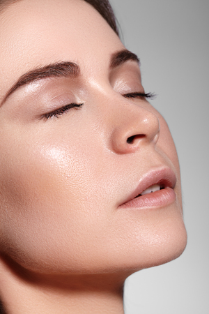 Beauty Woman Face Portrait. Beautiful Spa Model Girl with Perfect Fresh Clean Skin. Youth and Skin Care Concept.の写真素材