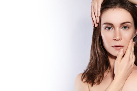 Beauty Woman Face Portrait. Beautiful Spa Model Girl with Perfect Fresh Clean Skin. Youth and Skin Care Concept.の写真素材