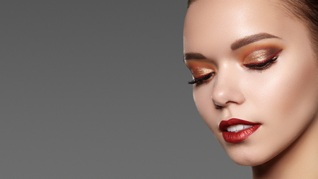 Beautiful Woman with Professional Makeup. Celebrate Style Eye Make-up, Perfect Eyebrows, Shine Skin. Bright Fashion Look.の写真素材
