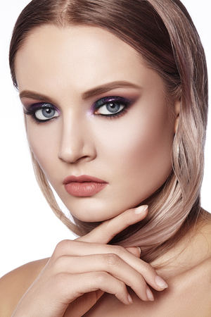 Beautiful Woman with Professional Makeup. Celebrate Style Eye Make-up, Perfect Eyebrows, Shine Skin. Bright Fashion Look.の写真素材