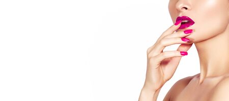 Beautiful Woman with Fashion Red Nails Manicure and Bright Makeup Lips. Fashion Nail Polish with Gel Lacquer, Gloss Lip Make-up.の写真素材