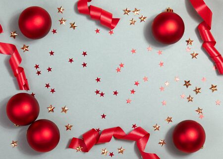Beautiful Christmas Background with Shiny Red Balls and Ribbon in Bright Color. Top view with Copy Space.の写真素材