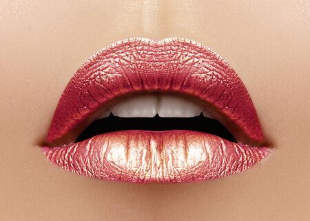 Beautiful Closeup with Female Plump Lips with Shiny Pink Makeup. Fashion Celebrate Make-up, Glitter Cosmetic. Metalic Lip Makeupの写真素材