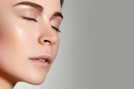 Beauty Woman Face Portrait. Beautiful Spa Model Girl with Perfect Fresh Clean Skin. Youth and Skin Care Concept. Spa, Wellness and health careの写真素材