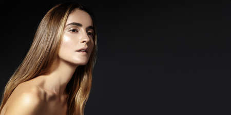Beautiful woman in a necklace. Model in jewelry from silver. Beautiful indian jewelery. Bright lights photo effectの写真素材
