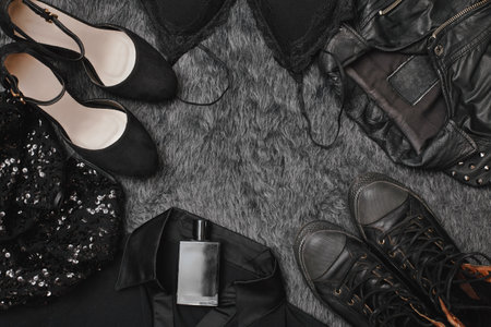 Black Friday Sale Fashion Dark Background. Black Clothes Flat Lay with Shoes, Fragrance, Lingerie,...