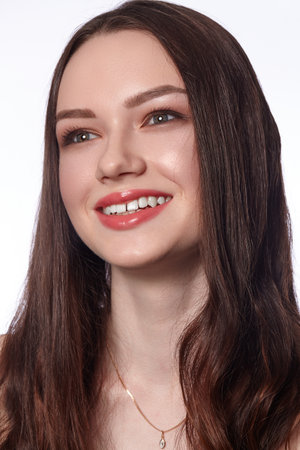 Beautiful Smiling Woman with Clean Skin, Natural Make-Up. Joyfull and Happiness. Emotional Female Face. Health, Wellnessの写真素材
