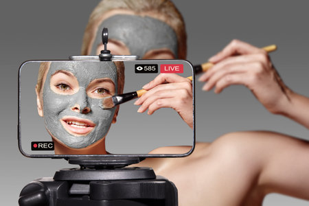 Woman Beauty Vlogger. Video Clip by Smartphone Sharing on Social Media. Fashion Blogger Live. Skin Care Routine Tutorialの写真素材