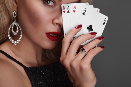 Blonde lady woman in black shiny dress and expensive diamond jewelry is winner money from Omaha...