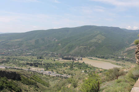 Beautiful stormy mountain river, stream flowing through the gorgeの写真素材