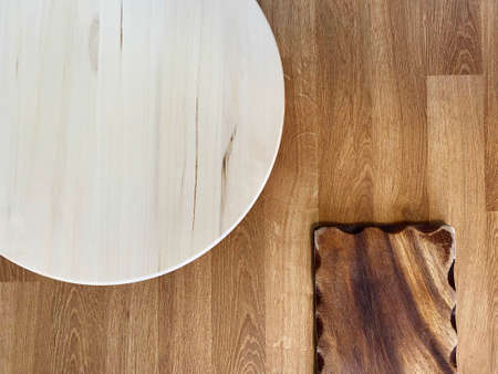 wooden surface of different shades, shapes and textures, wood grain texture background, light round...
